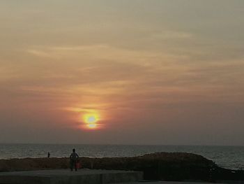 Scenic view of sea at sunset