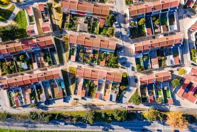 High angle view of buildings by swimming pool in city