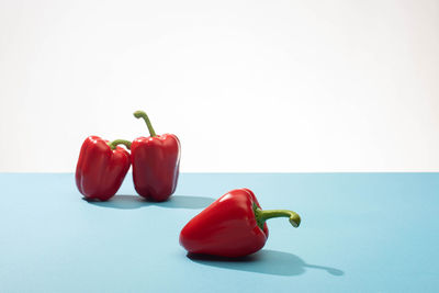 Close-up of bell peppers against white background