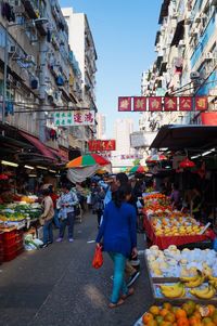 People at street market in city