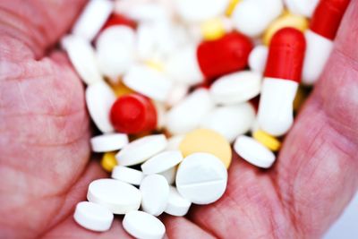 Close-up of human hand holding medicines