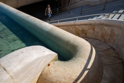 High angle view of people walking on staircase