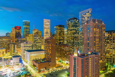 Modern buildings in city against sky