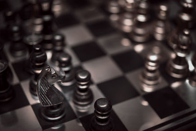High angle view of chess pieces on board