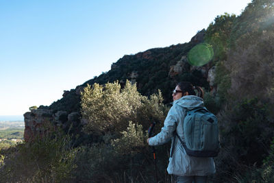 Rear view of man standing on mountain