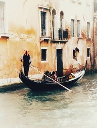 Man in boat sailing on canal