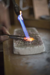 Cropped hand of person working in workshop