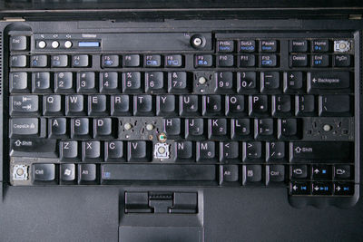 Full frame shot of computer keyboard with broken keys