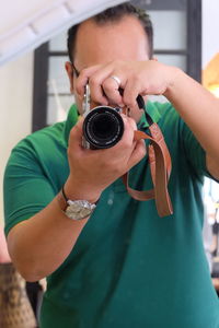 Portrait of woman photographing