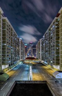 Illuminated city against sky at night