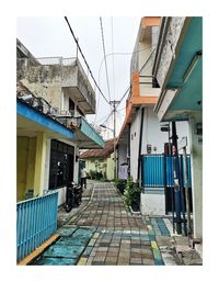 Empty alley amidst buildings in town