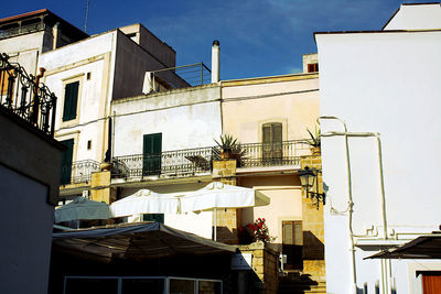 Exterior of buildings in town against sky