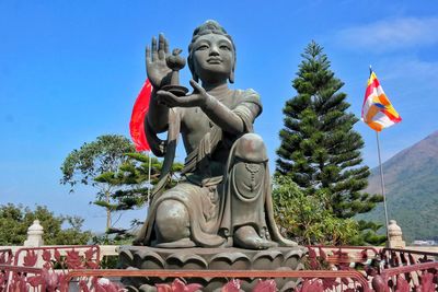 Low angle view of statue against sky