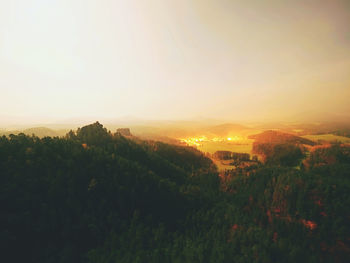 Scenic view of landscape against sky during sunset