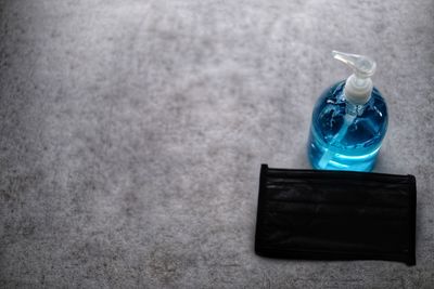 High angle view of glass bottle on table