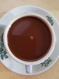 High angle view of coffee cup on table