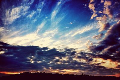 Scenic view of landscape against cloudy sky