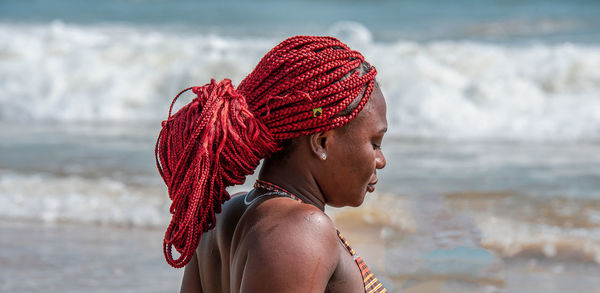 Portrait of woman looking at sea