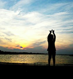 Silhouette of man standing on beach