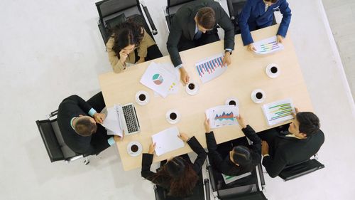 High angle view of people on table