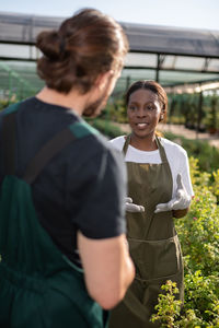 Black farmer speaking with colleague