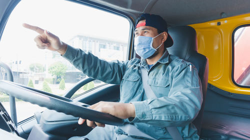 Man sitting in car