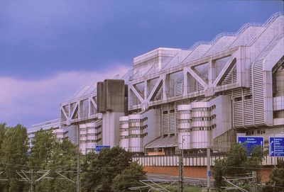 Low angle view of office building against sky