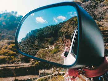 Reflection of road on side-view mirror