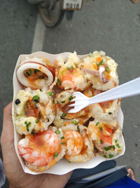 Close-up of hand holding ice cream