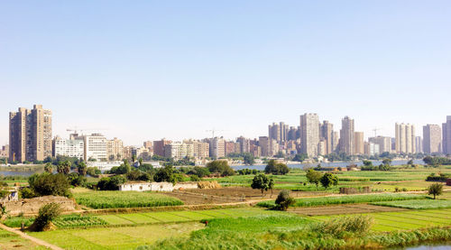 View of cityscape against clear sky