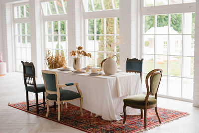 Empty chairs and tables in restaurant