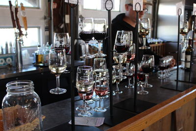 Glass of wine bottles on table in restaurant