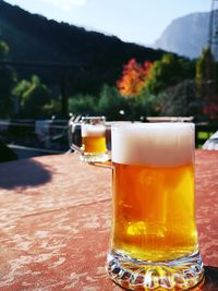 Close-up of beer glass on table