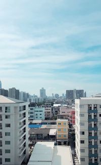 High angle view of buildings in city against sky