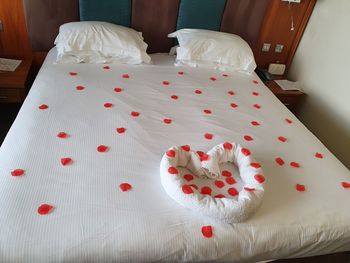 High angle view of heart shape on bed at home