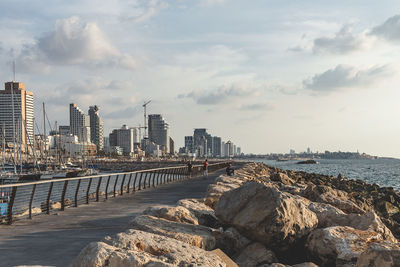 Panoramic view of sea and buildings against sky