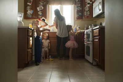 Family in kitchen at home