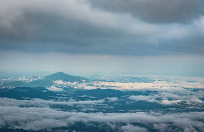 Aerial view of clouds over mountain