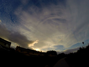 Low angle view of built structure against cloudy sky