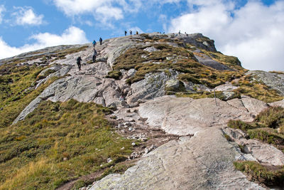 Low angle view of rock formations against sky