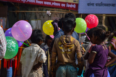 Group of people in front of balloons