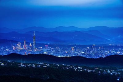 Illuminated buildings in city at night