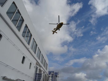 Low angle view of airplane flying in sky