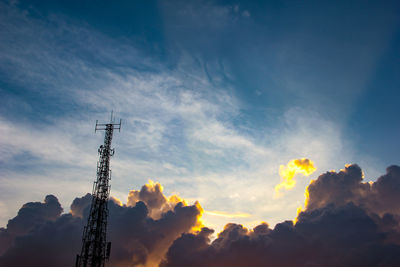 Low angle view of electricity pylon against sky