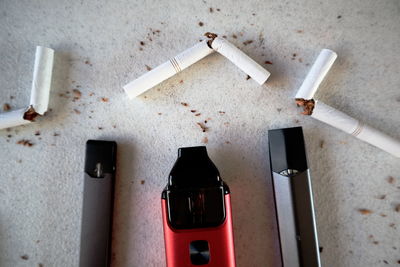 High angle view of cigarette on wall