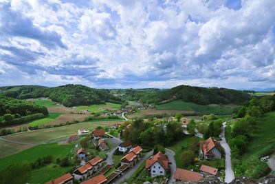 Scenic view of landscape against cloudy sky