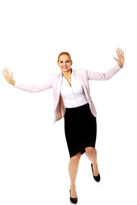 Full length of woman standing against white background