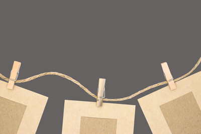 Low angle view of rope against white background