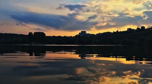 Scenic view of lake against sky during sunset