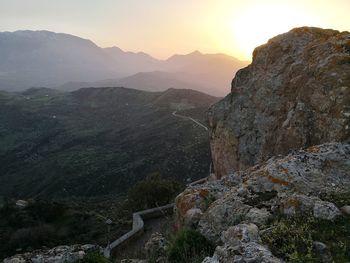 Scenic view of mountains against sky during sunset